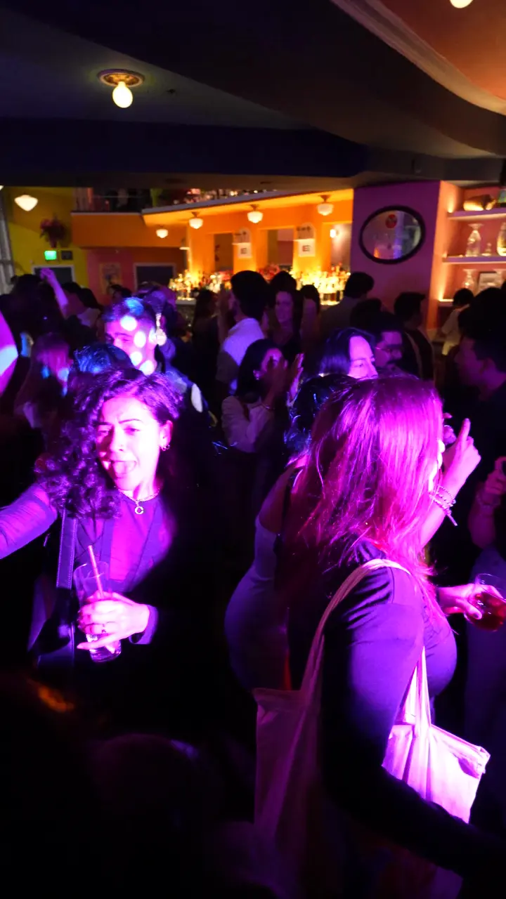 A packed dance floor cheering for the camera at The Long Weekend in San Francisco
